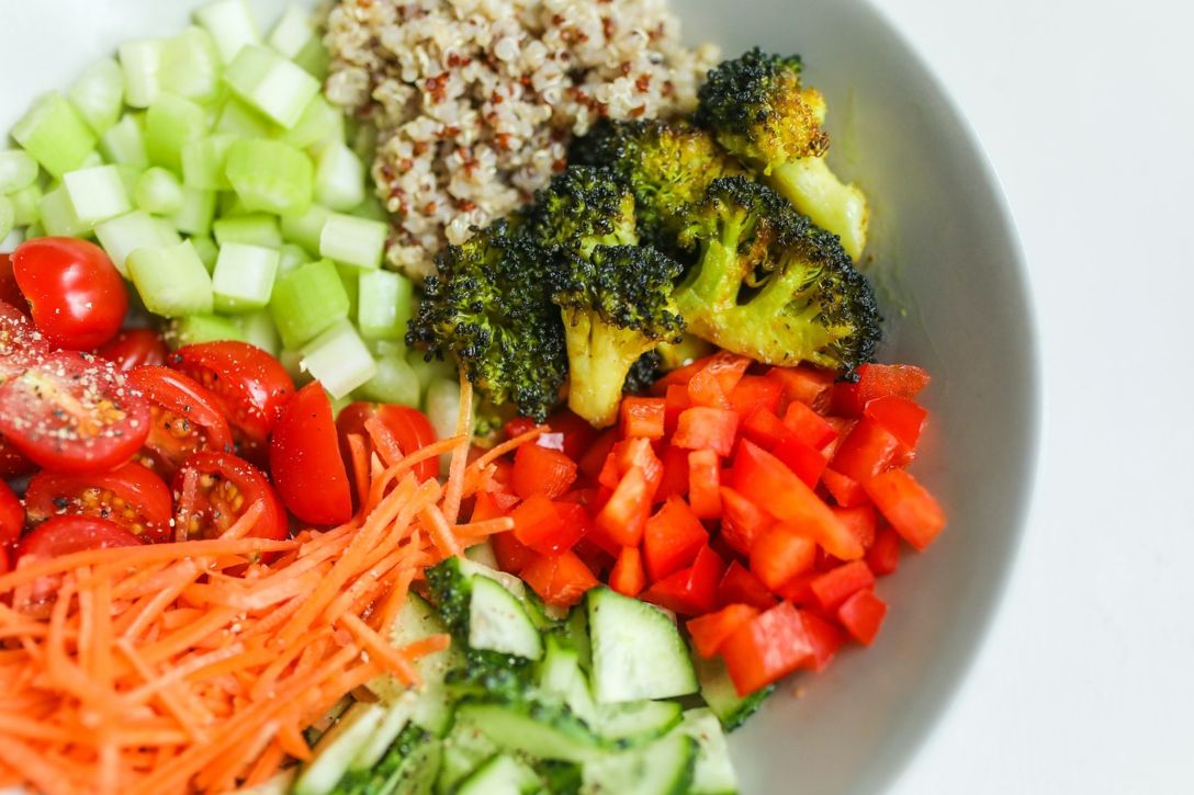 Colorful vegetables and quinoa in bowl