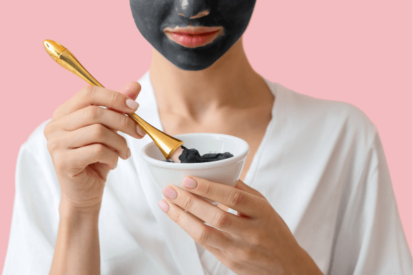 Woman with Activated Charcoal Mask - Toxin Binders