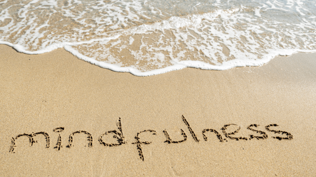 How to be mindful - picture of a beach with the word mindfulness