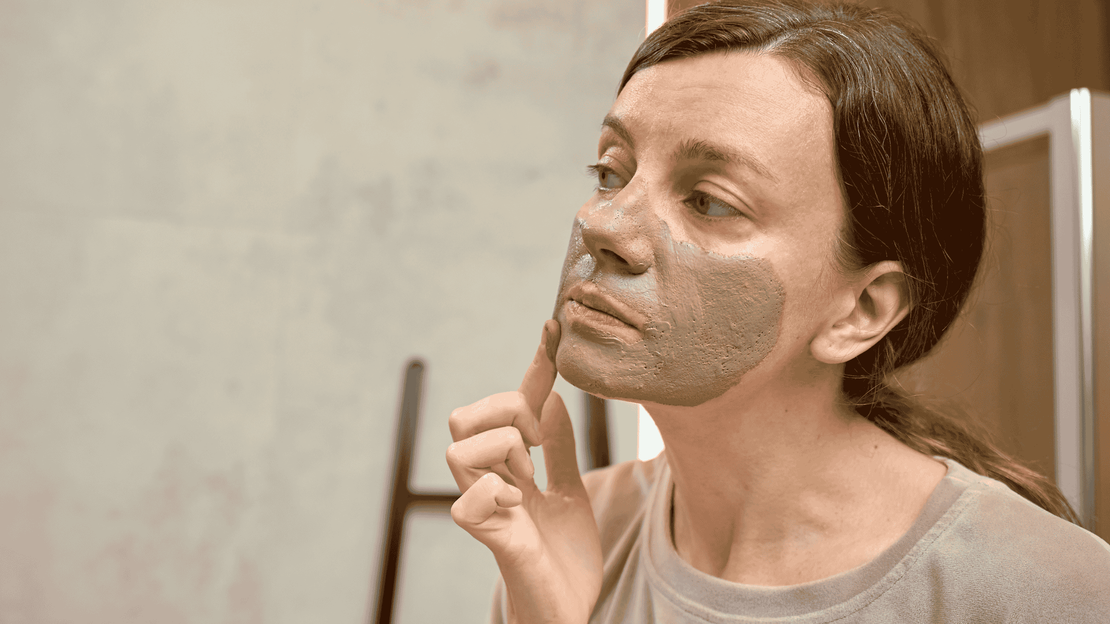 Woman with bentonite clay mask