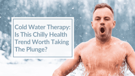 A man in a chilly, icy lake debating the question - why cold plunge? Overlay Text: Cold Water Therapy: Is This Chilly Health Trend Worth Taking The Plunge?