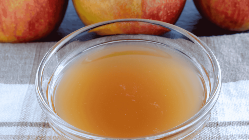 A bowl of cloudy ACV - to showcase the uses of apple cider vinegar