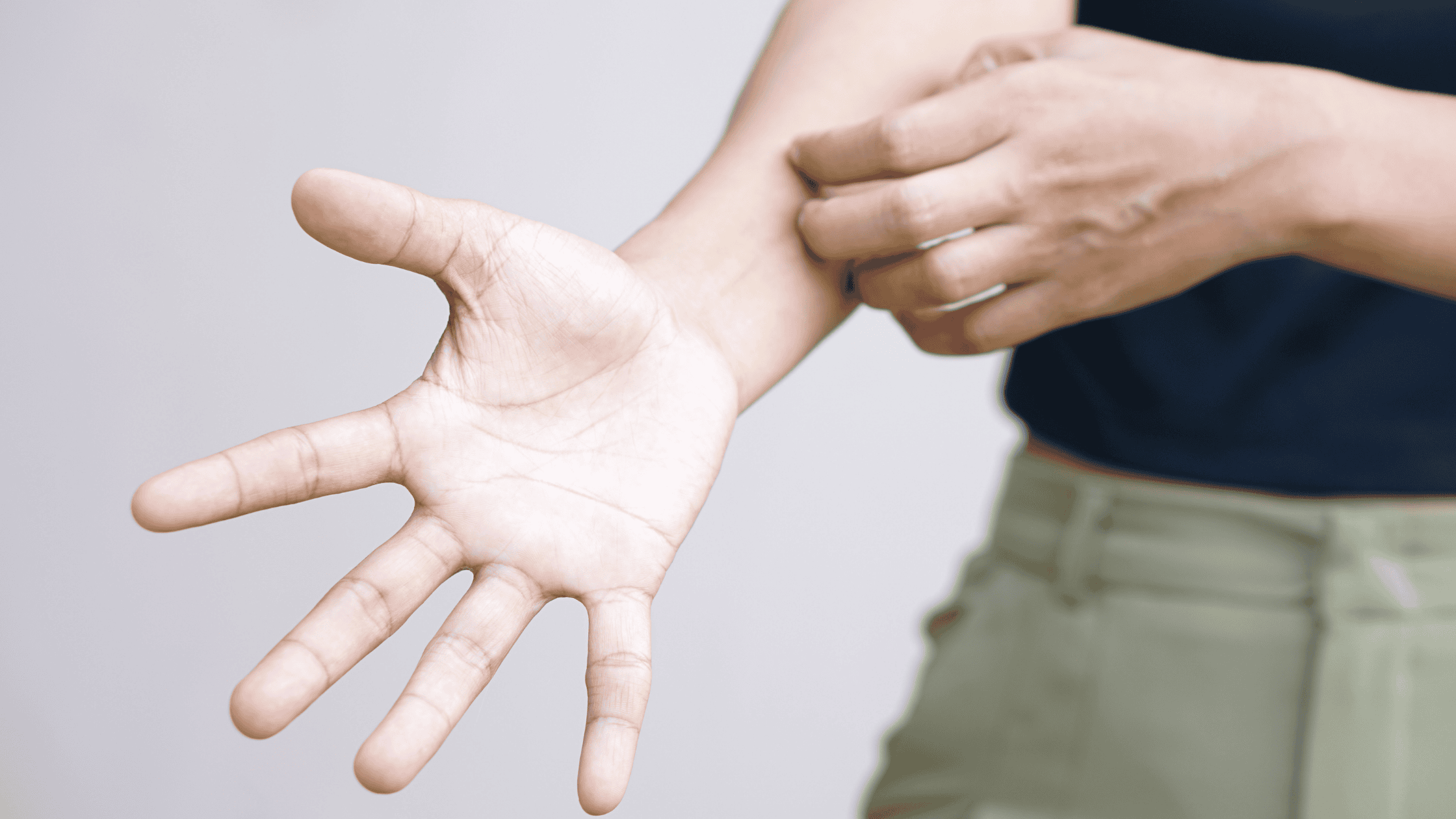 person itching skin, close up of hand.