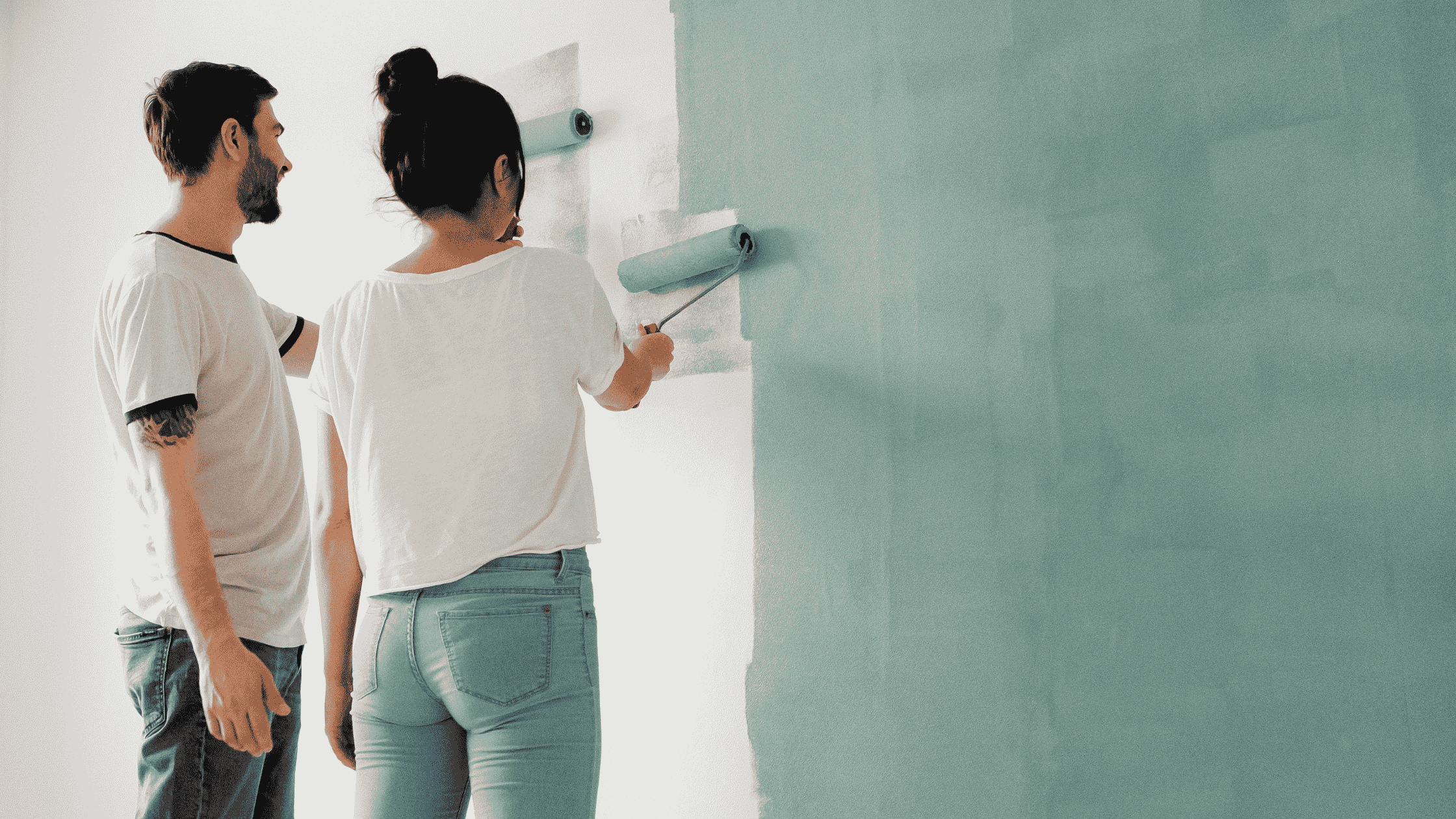 A couple paints their wall blue. This is to demonstrate VOC's in a toxic house. 