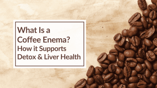 An image of loose coffee beans over a tan background. Text Overlay: What Is a Coffee Enema? How it Supports Detox & Liver Health