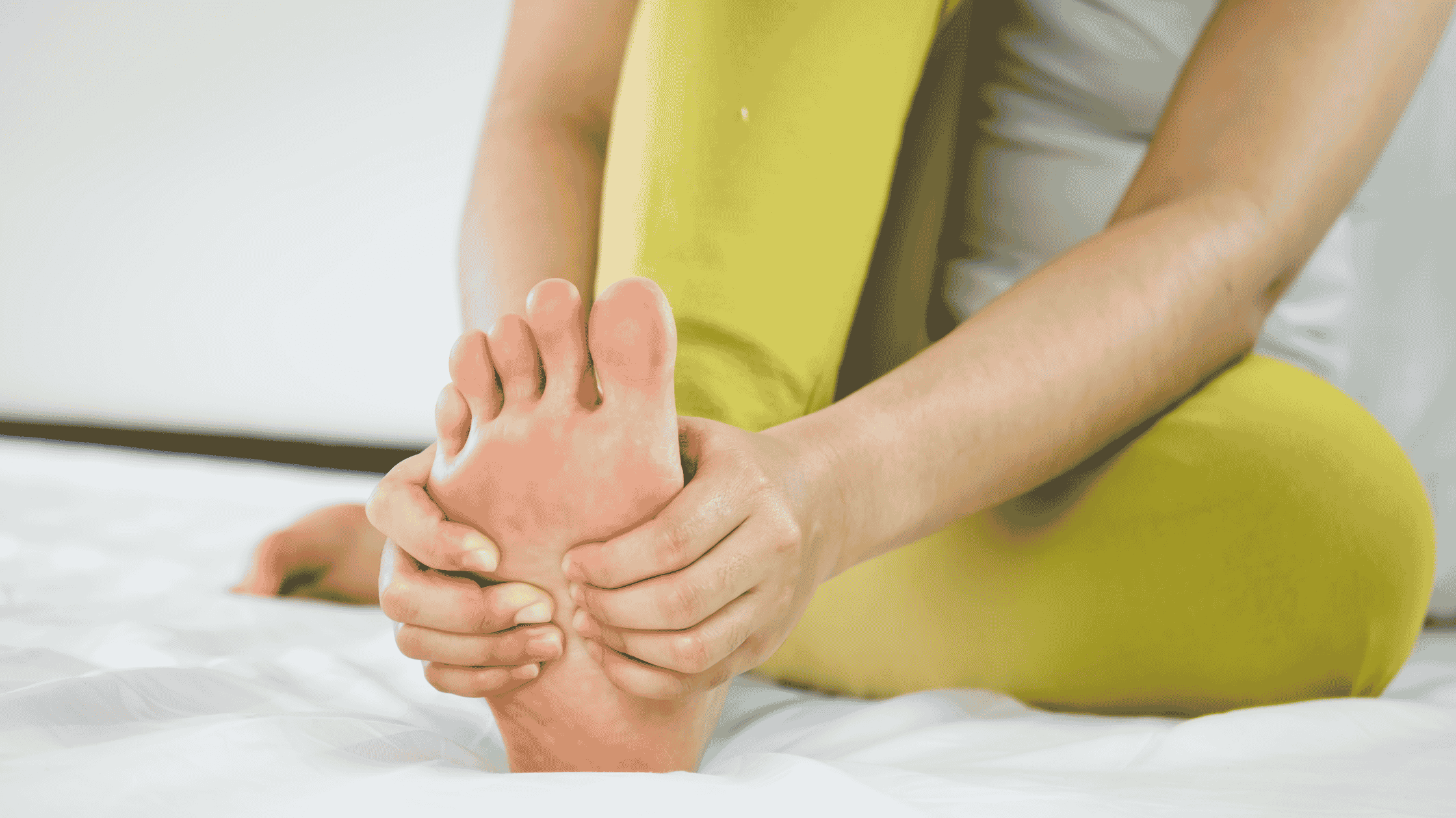 woman rubbing castor oil on feet for detox. 