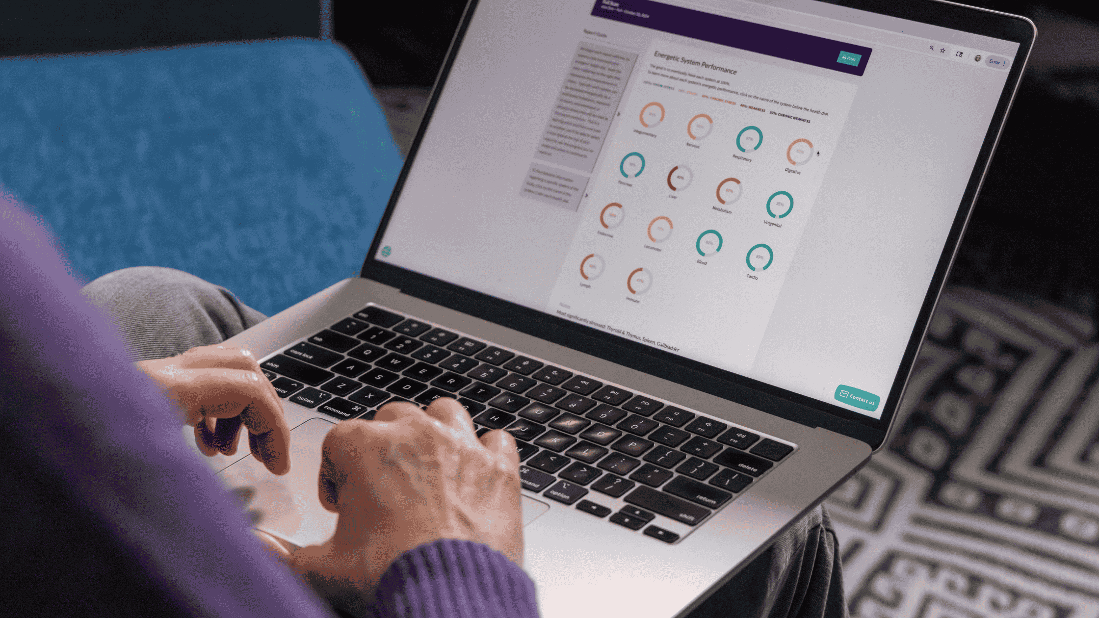 Close up of hands on a laptop, CBH Energetics report on the screen.