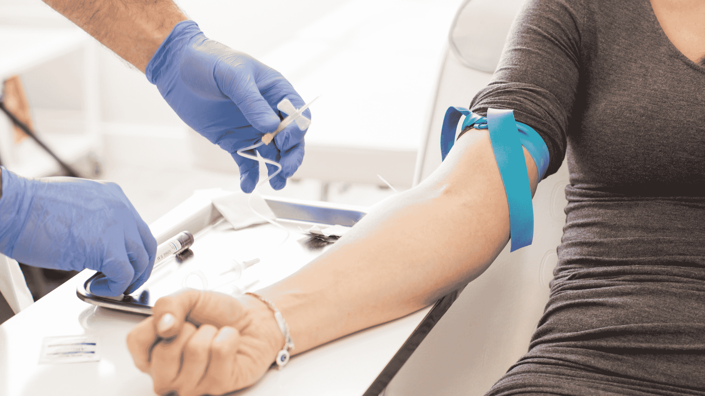 Medical professional drawing blood for laboratory testing 