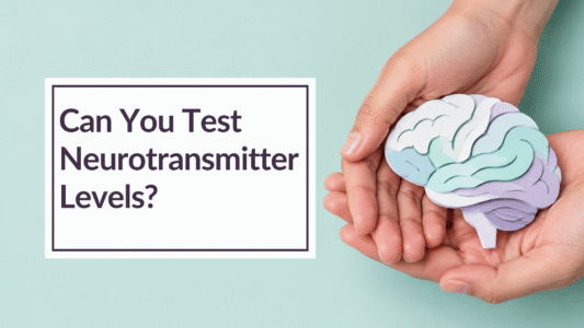 hands holding a paper model of a brain. Overlay Text: Can you test neurotransmitter levels?